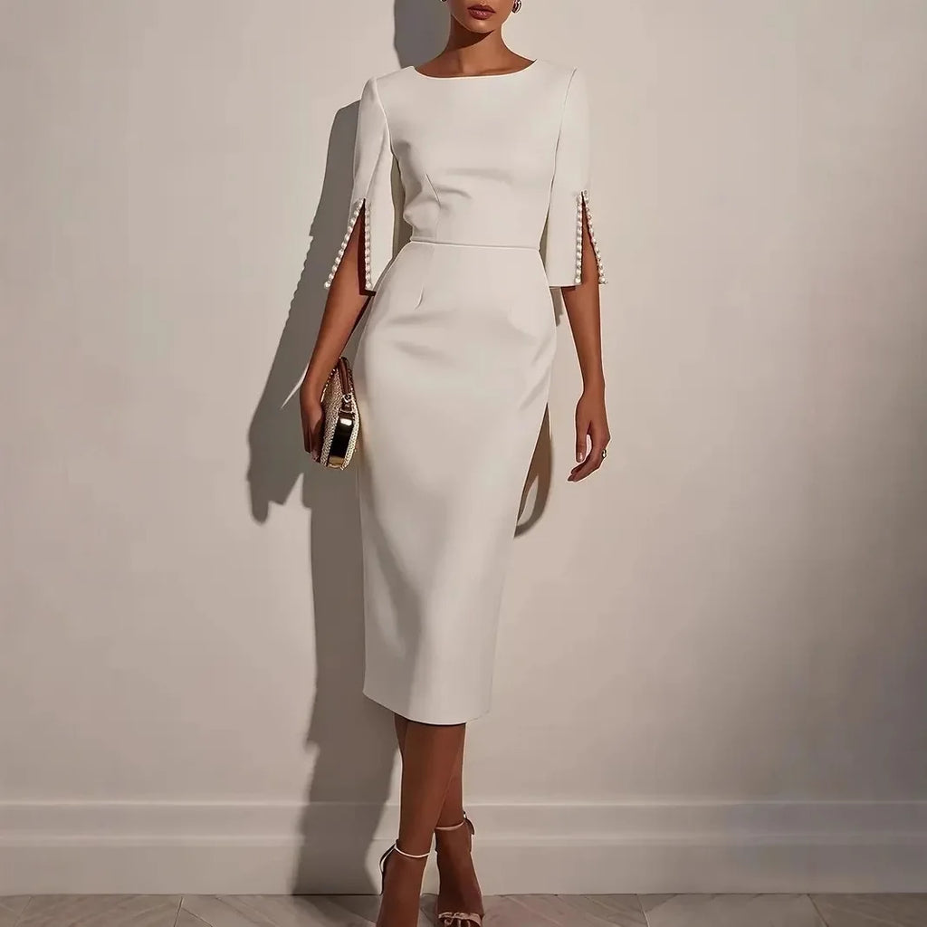 Nerina | VESTIDO ELEGANTE CON MANGAS ABIERTAS DECORADAS CON PERLAS