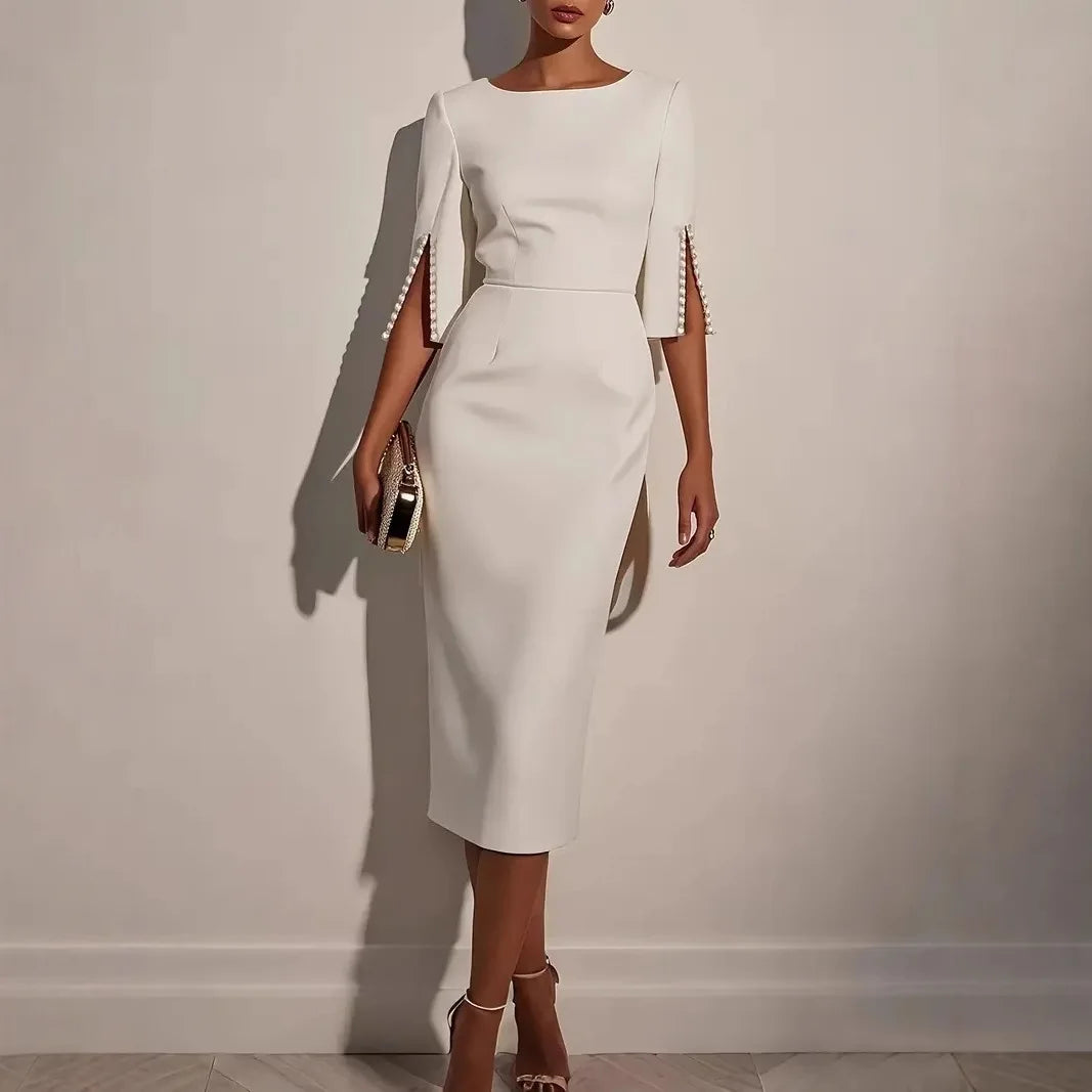 Nerina | VESTIDO ELEGANTE CON MANGAS ABIERTAS DECORADAS CON PERLAS