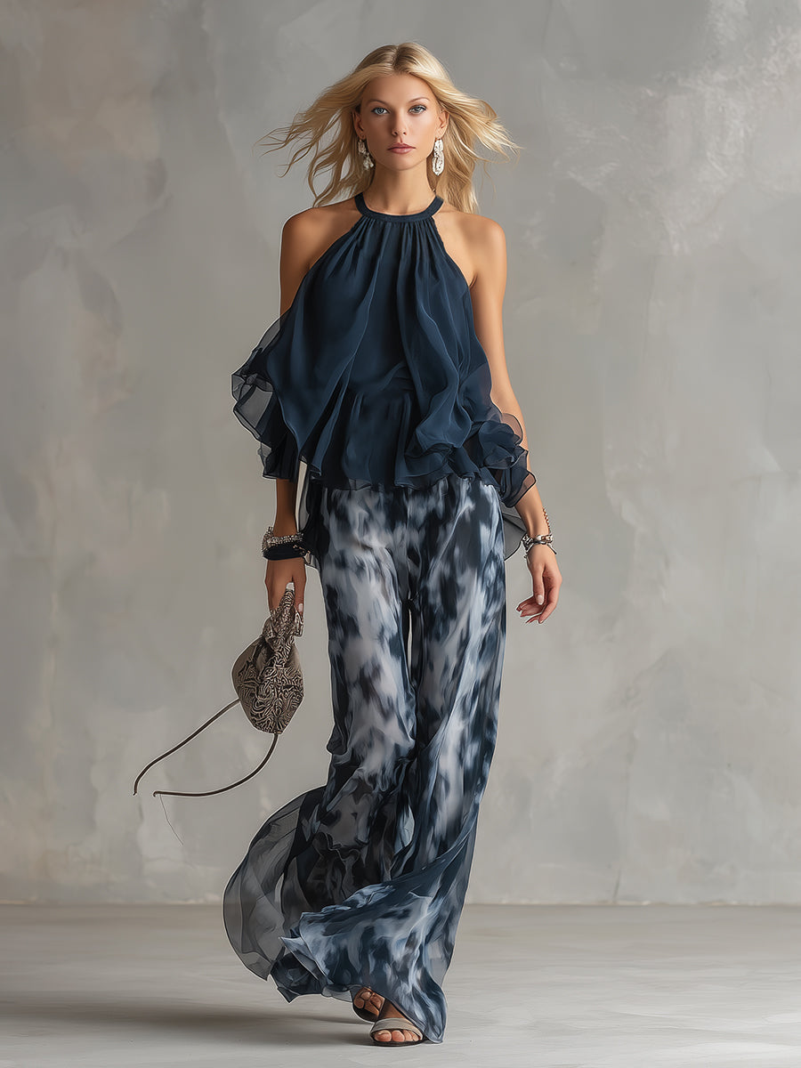 Ludovica - elegante vestido de gasa con corpiño de cuello alto y pantalón ancho estampado.