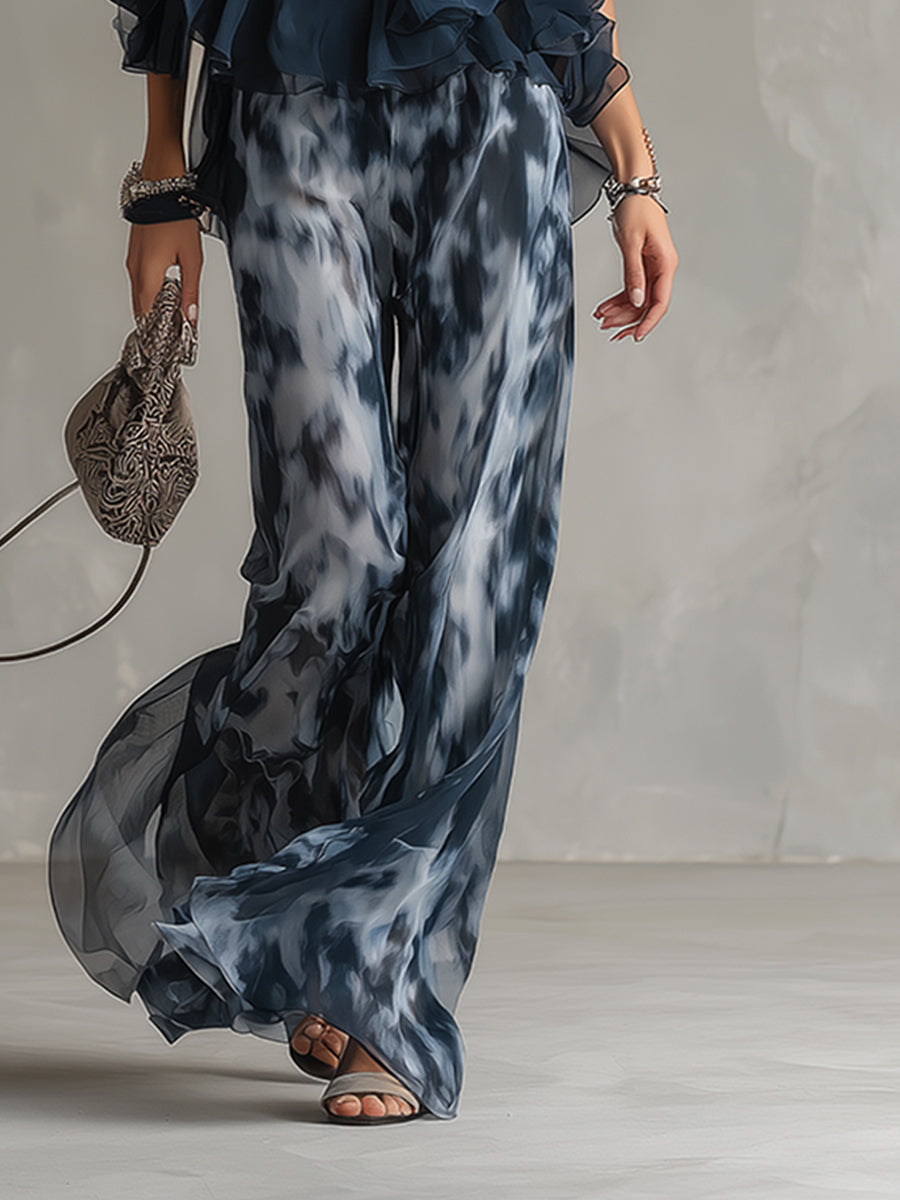 Ludovica - elegante vestido de gasa con corpiño de cuello alto y pantalón ancho estampado.